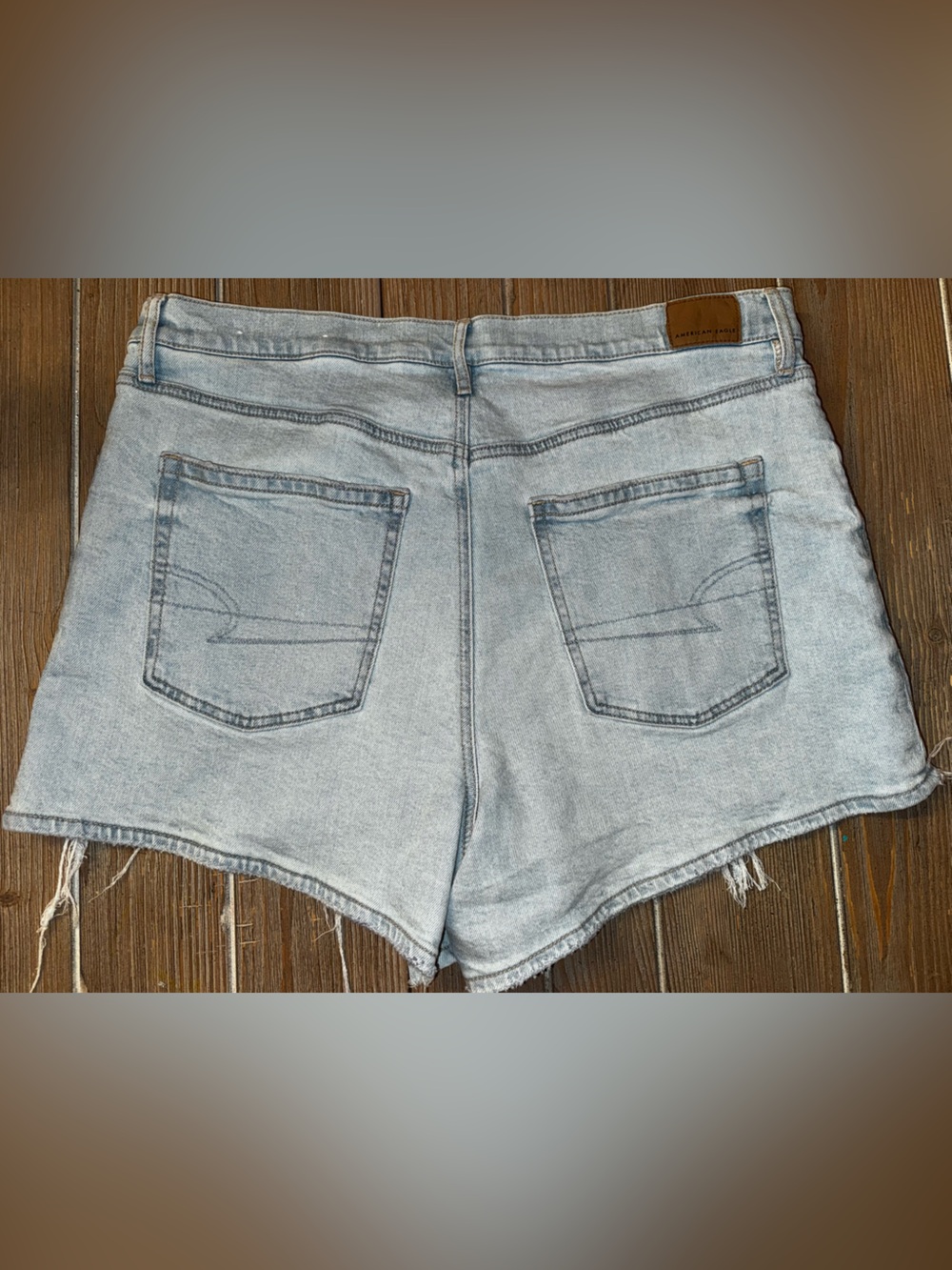 American Eagle Outfitters Relxed Fit Light Wash Distressed Denim Cutoff Shorts - Picture 6 of 12